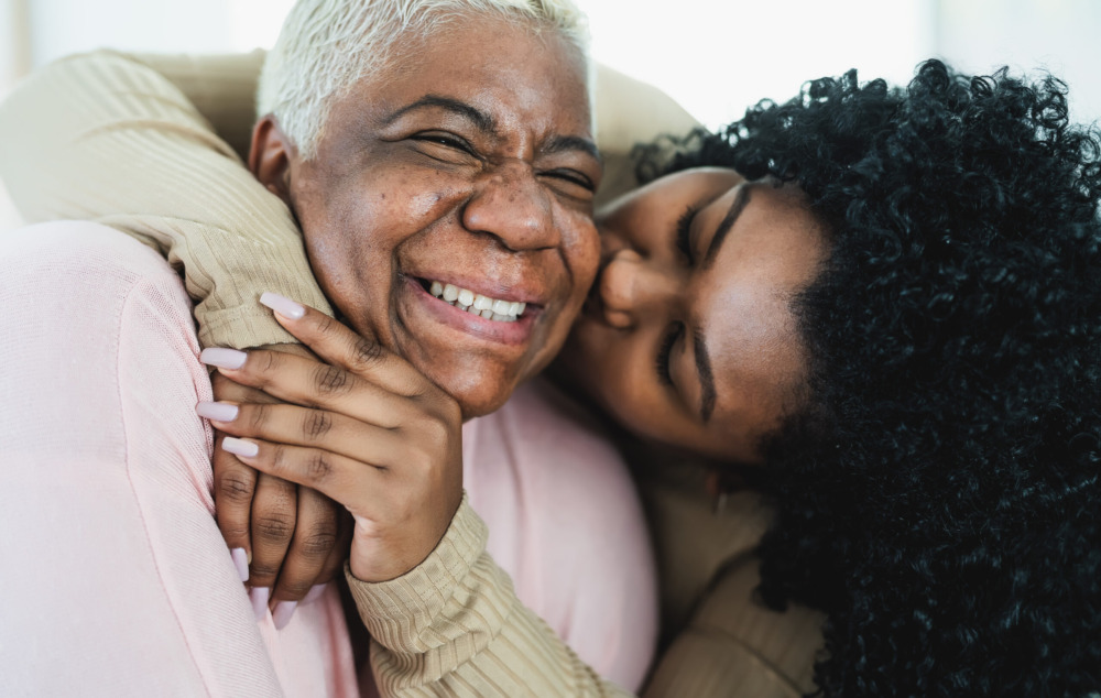 Happy mother and daughter having tender moment together