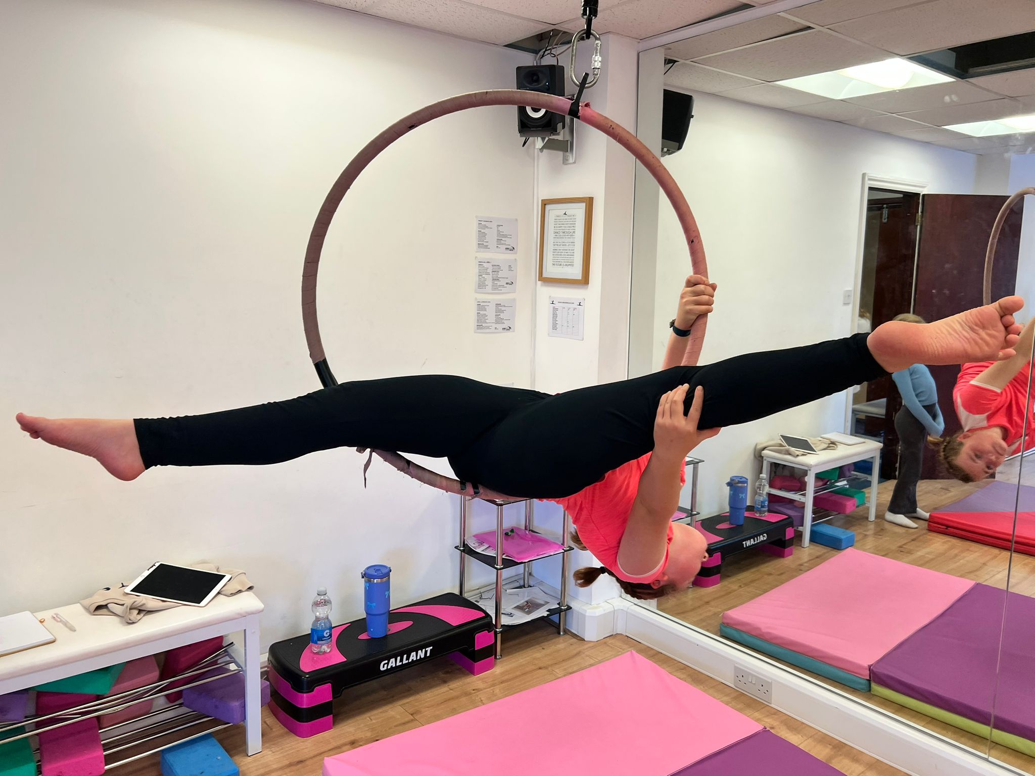 A 9 year old girl at her acrobatics class